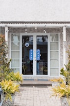 Front entrance of Prime Door Solutions office building with clear signage.