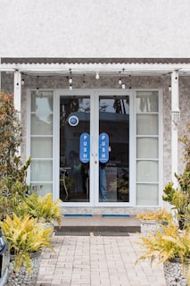 Community center entrance with welcoming doors and a bulletin board outside