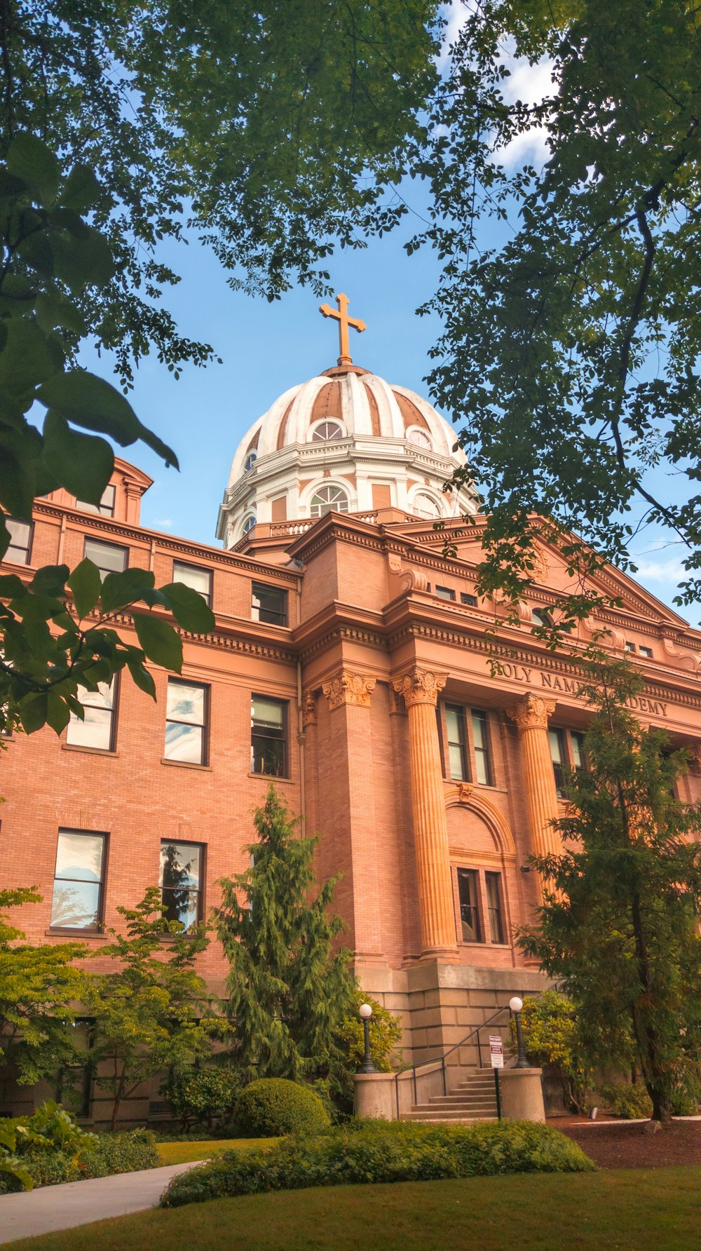 a large building with a cross on top of it