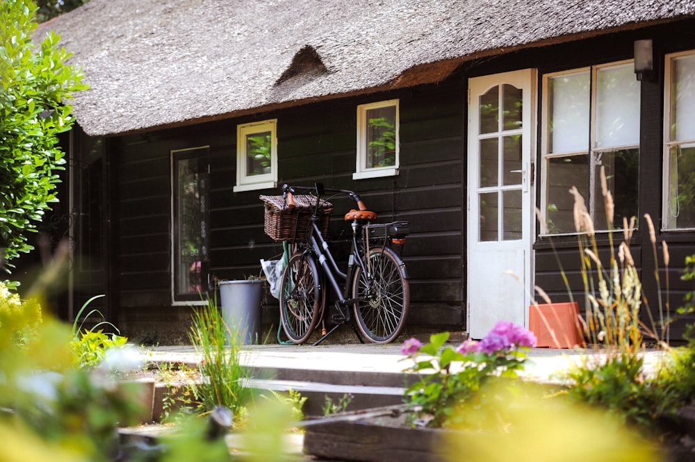 a couple of bikes are parked in front of a house