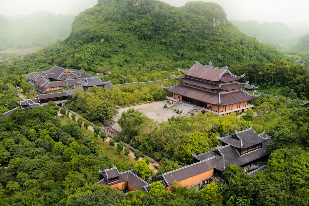 an aerial view of a building surrounded by trees