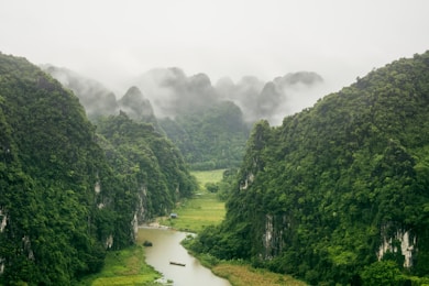 a view of a river surrounded by mountains