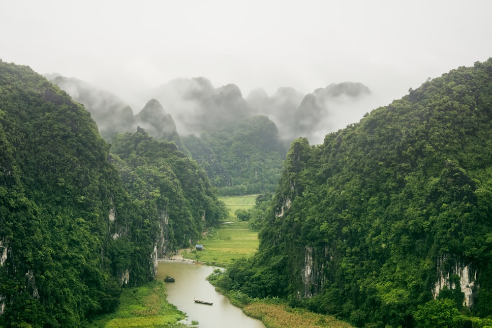 a view of a river surrounded by mountains