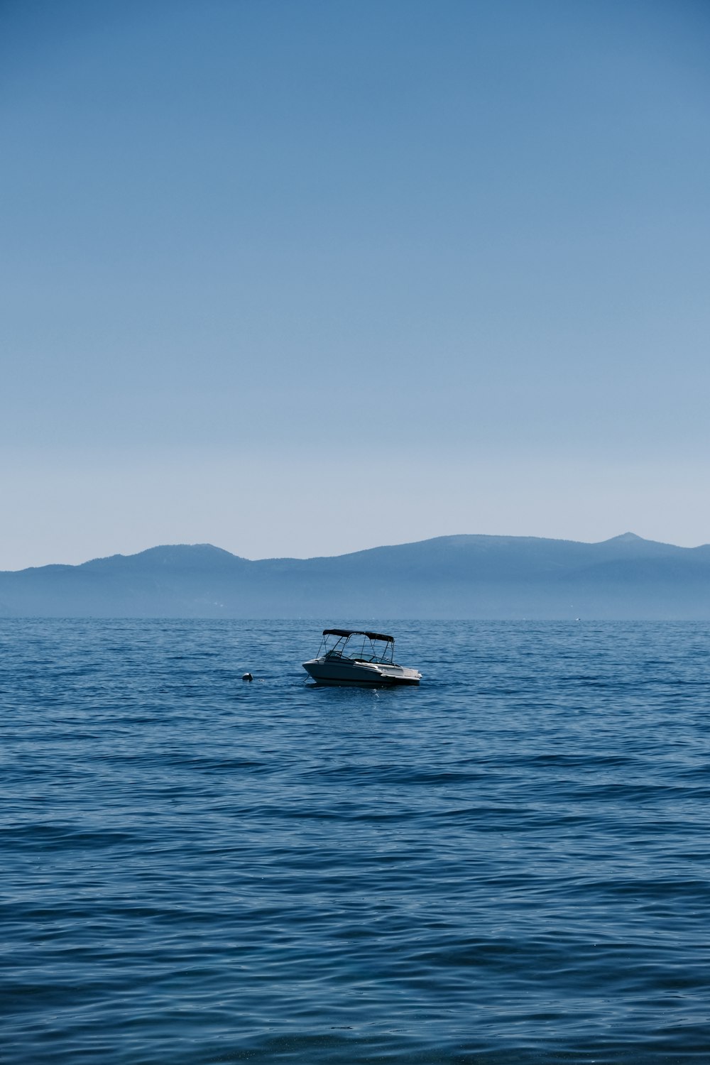 a boat floating on top of a large body of water