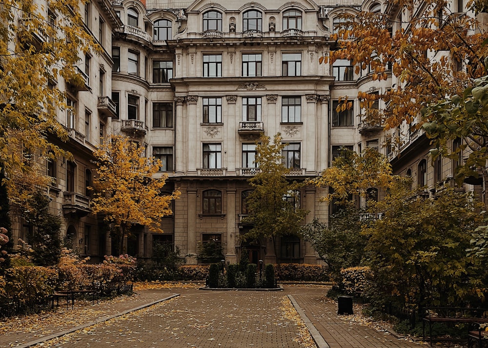 a large building with a lot of windows and lots of trees