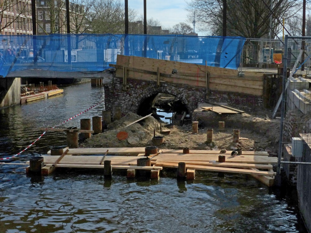 a bridge over a body of water under a blue bridge