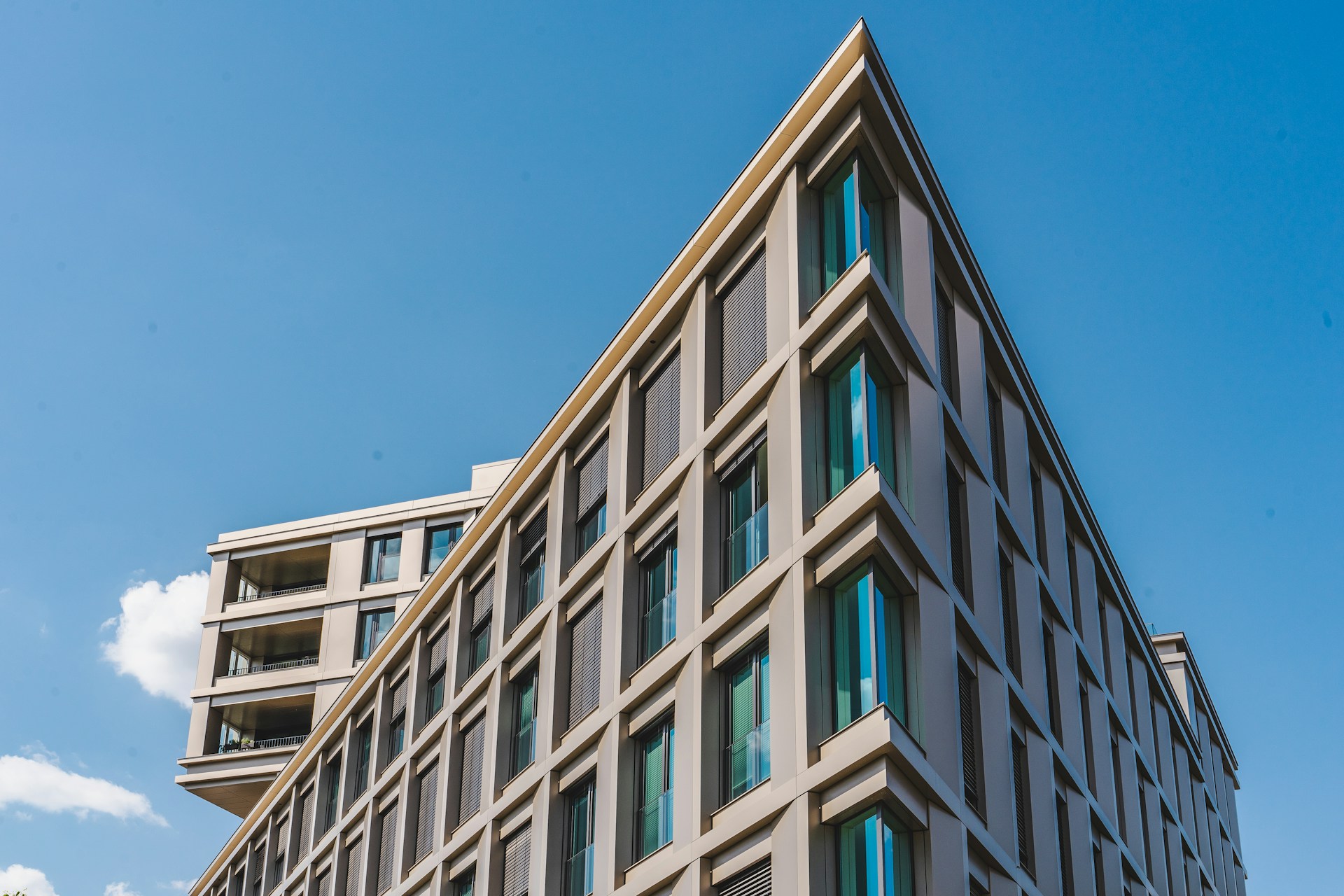 woman wearing yellow long-sleeved dress under white clouds and blue sky during daytime
