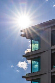 Wide shot of coated commercial building exterior glistening under sunlight.