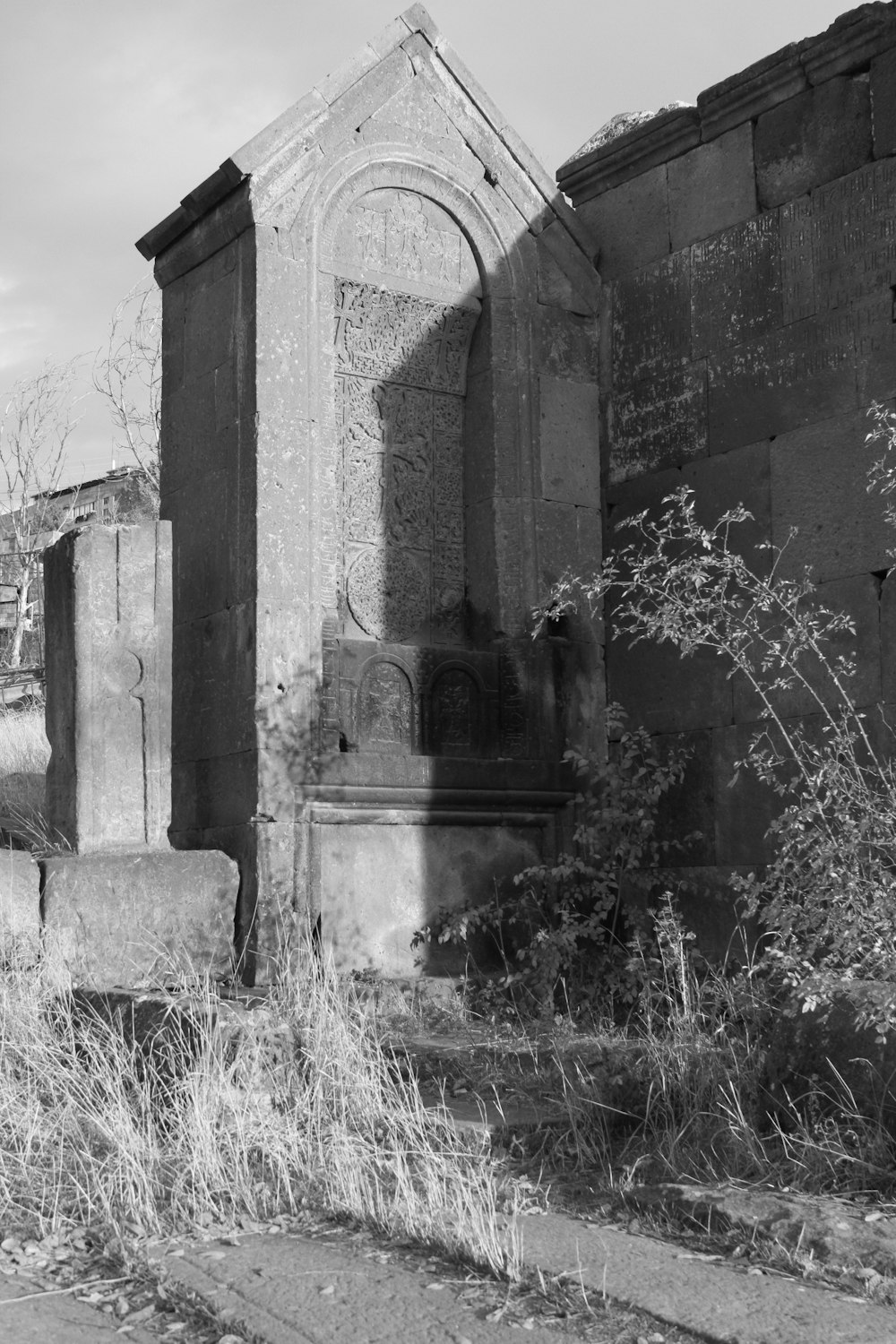 a black and white photo of an old cemetery