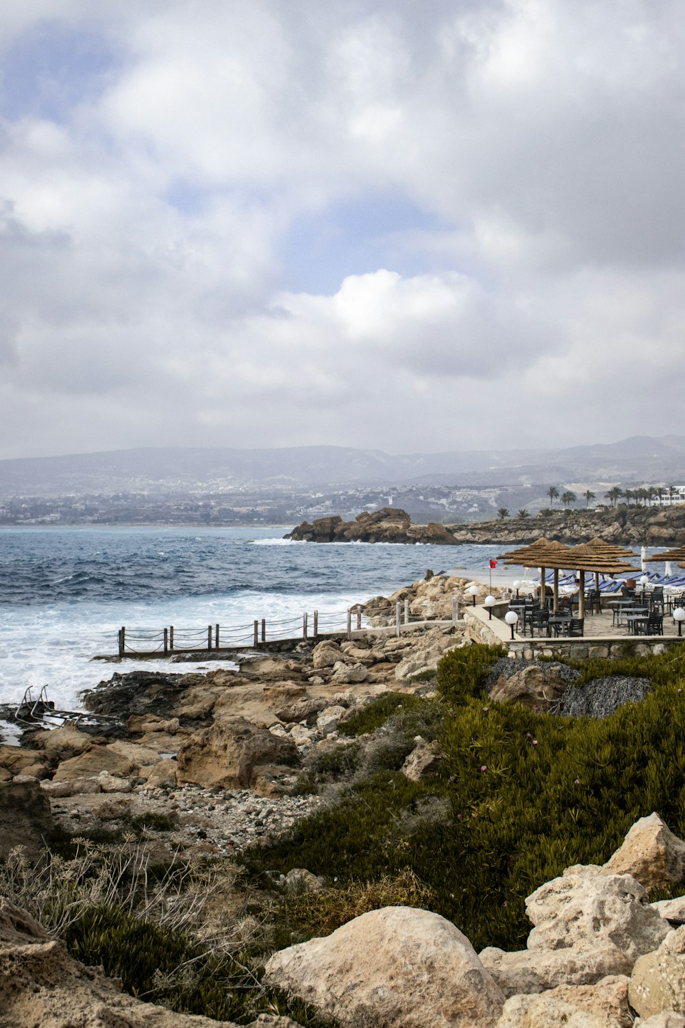 a view of a beach with a few people on it