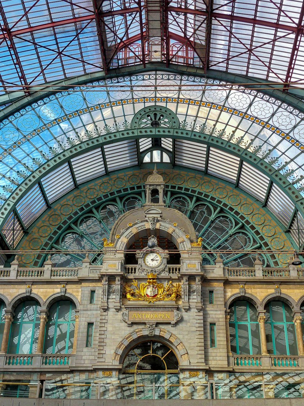 a train station with a clock on the front of it