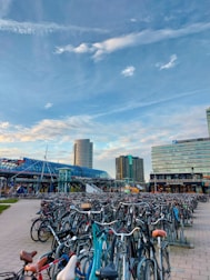 a bunch of bikes parked in a parking lot