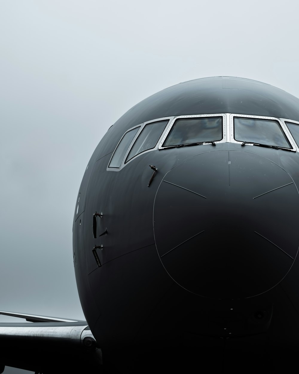 a large jetliner sitting on top of an airport tarmac