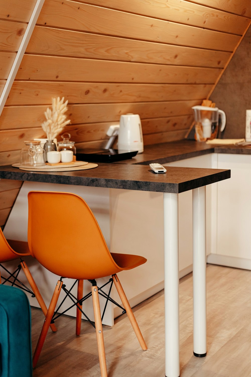 a kitchen with a table and two chairs