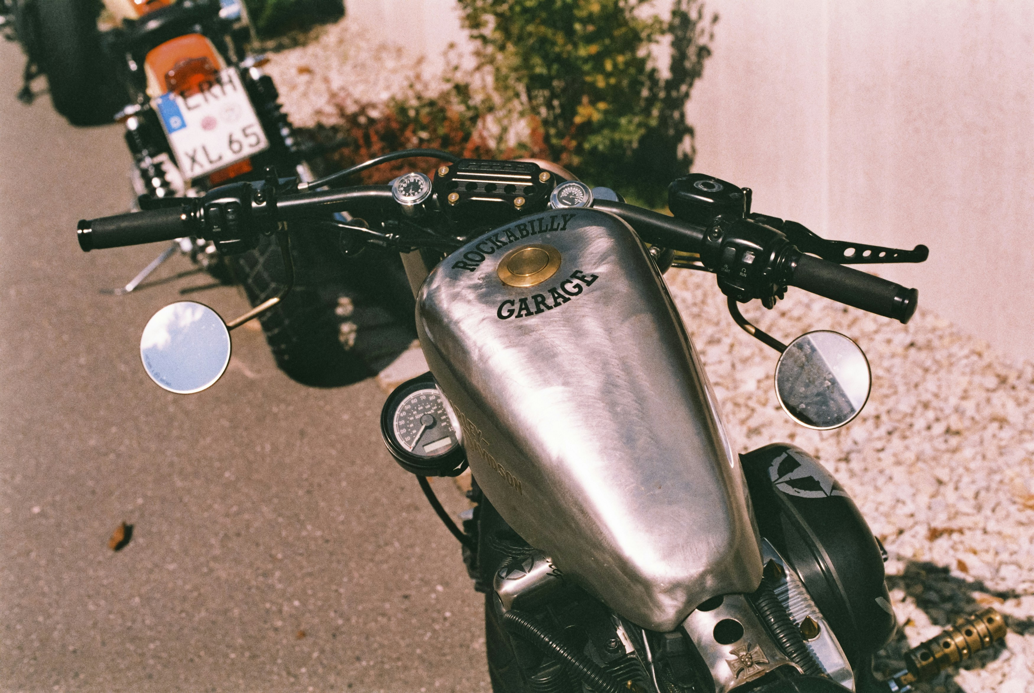 a silver motorcycle parked next to a building