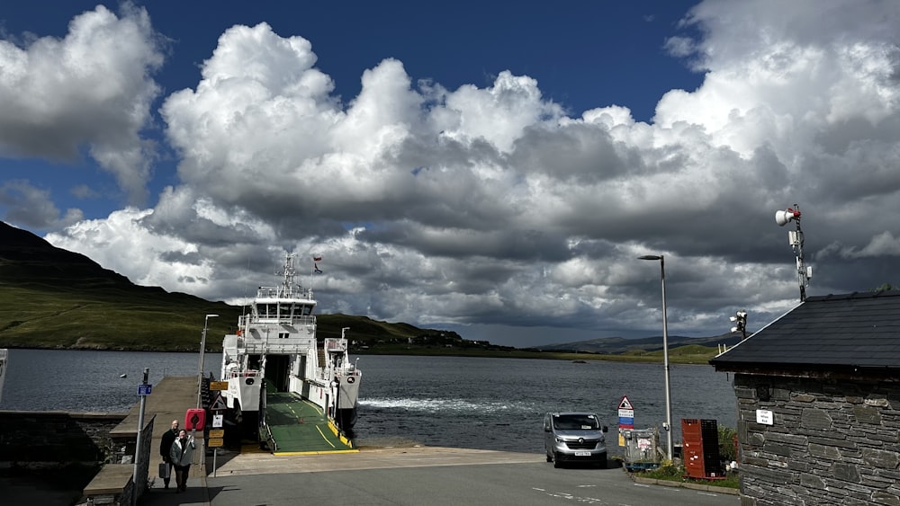 a car is parked at a ferry dock