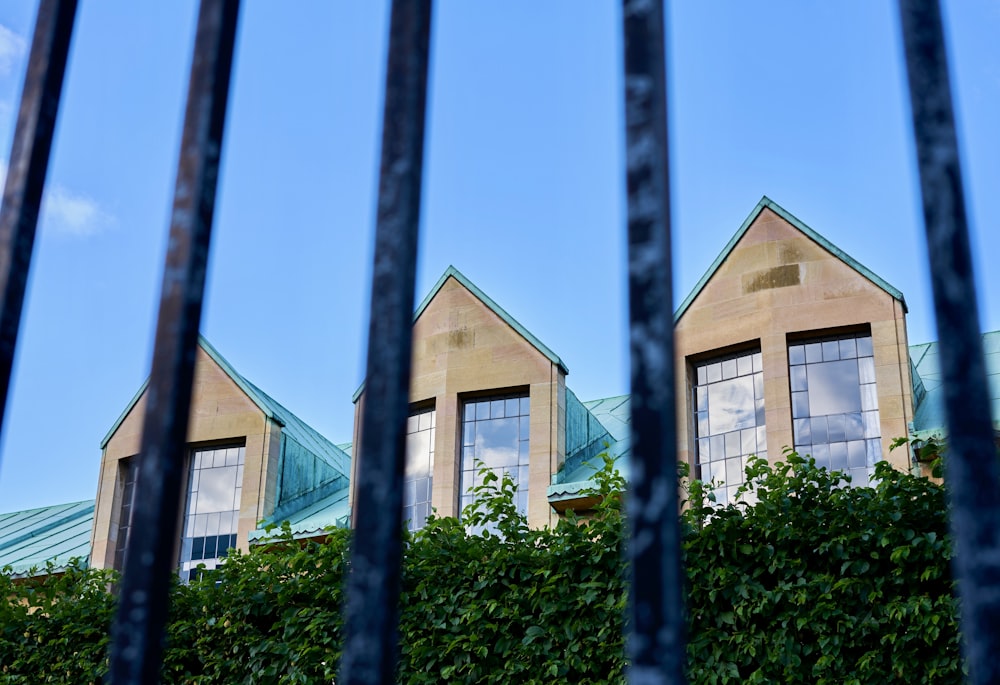 a view of a building through a fence