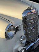Side view of a vintage Mercedes Benz with freshly restored chrome details