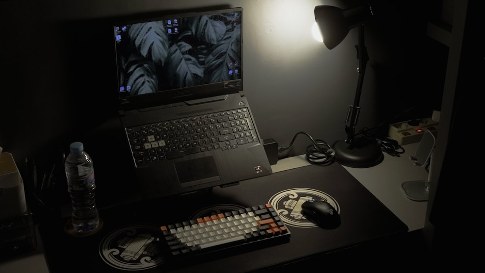 a laptop computer sitting on top of a desk