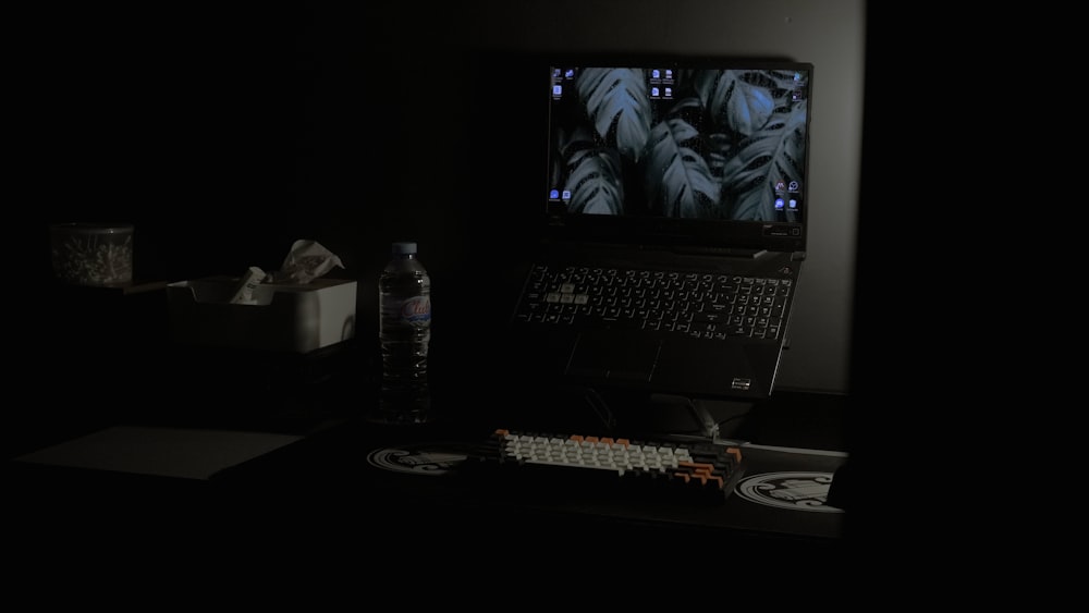 a laptop computer sitting on top of a desk