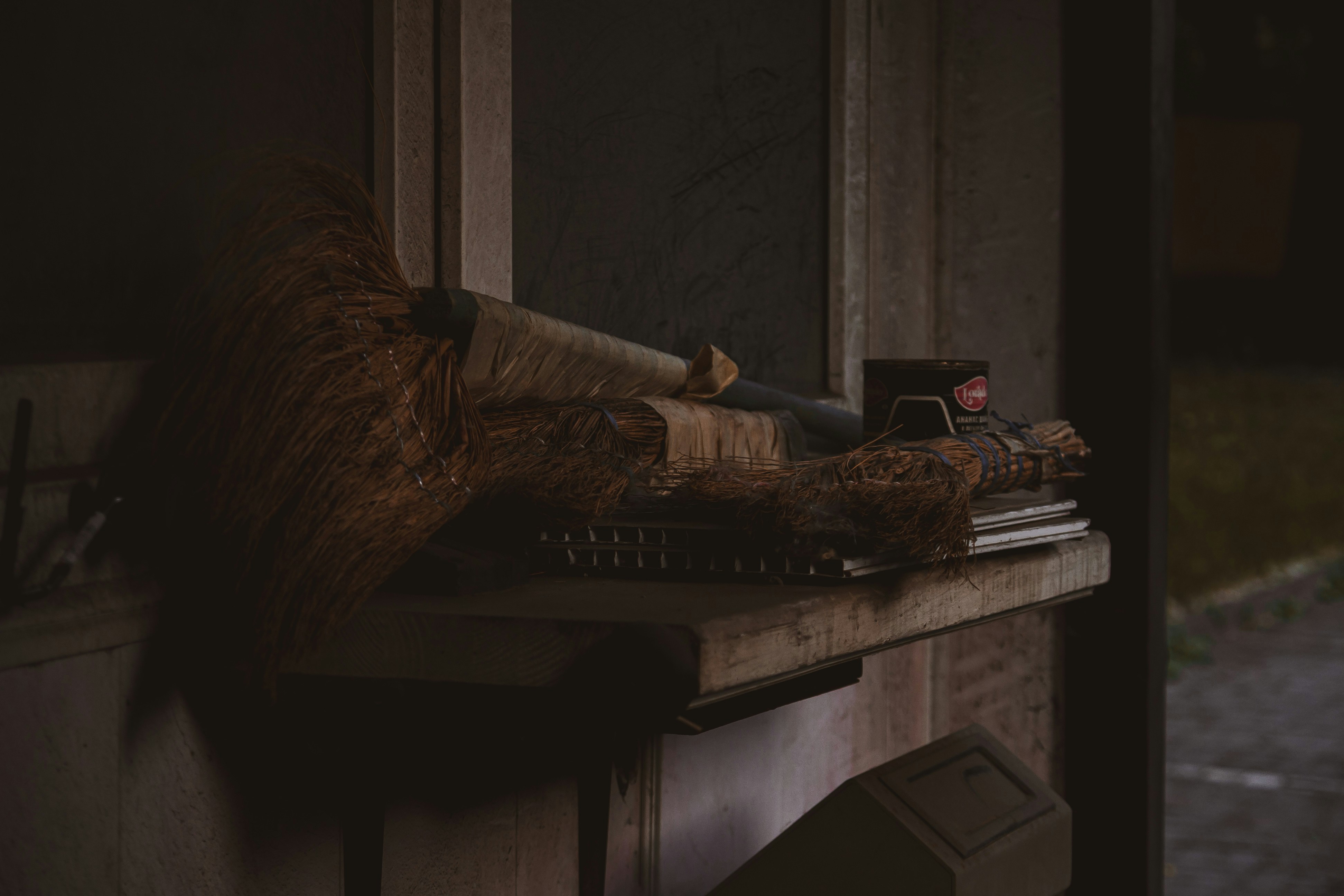 a window sill filled with books and a stuffed animal
