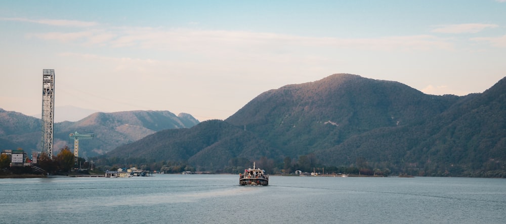 a boat traveling on a large body of water