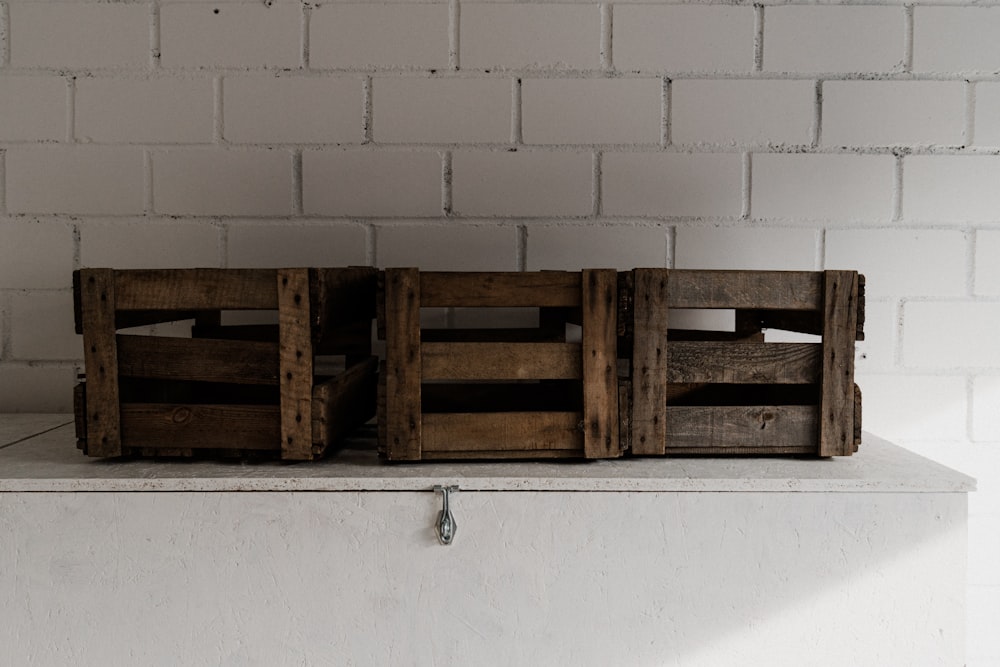 a couple of wooden crates sitting on top of a counter