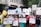 A diverse group of people are gathered for a protest or awareness event, holding various colorful signs advocating for disability rights and inclusion. Some signs have text promoting the inclusion of individuals with disabilities in sports and society, with messages like 'I want to turn my disability into ability' and 'Support Disability Rights.' The participants appear engaged and passionate about the cause.