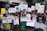 A group of people is gathered holding various signs and posters advocating for disability rights and empowerment. The signs carry messages promoting inclusivity, equal opportunities, and changing perceptions about disabilities. The crowd consists of diverse individuals, including children and adults.