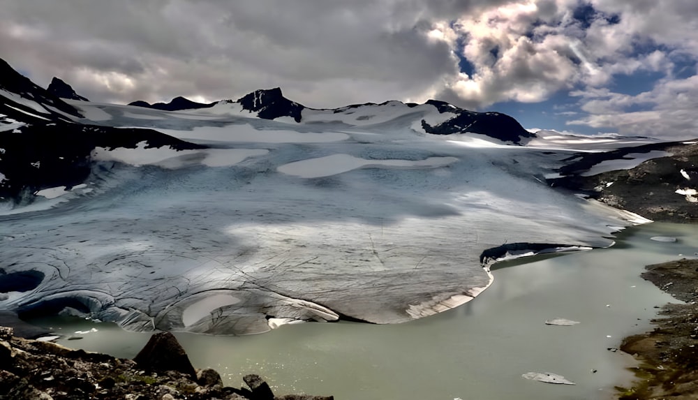 a large glacier with snow and ice on it