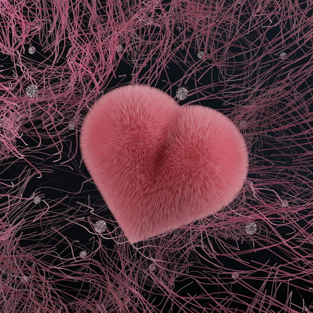 a pink heart on a black background