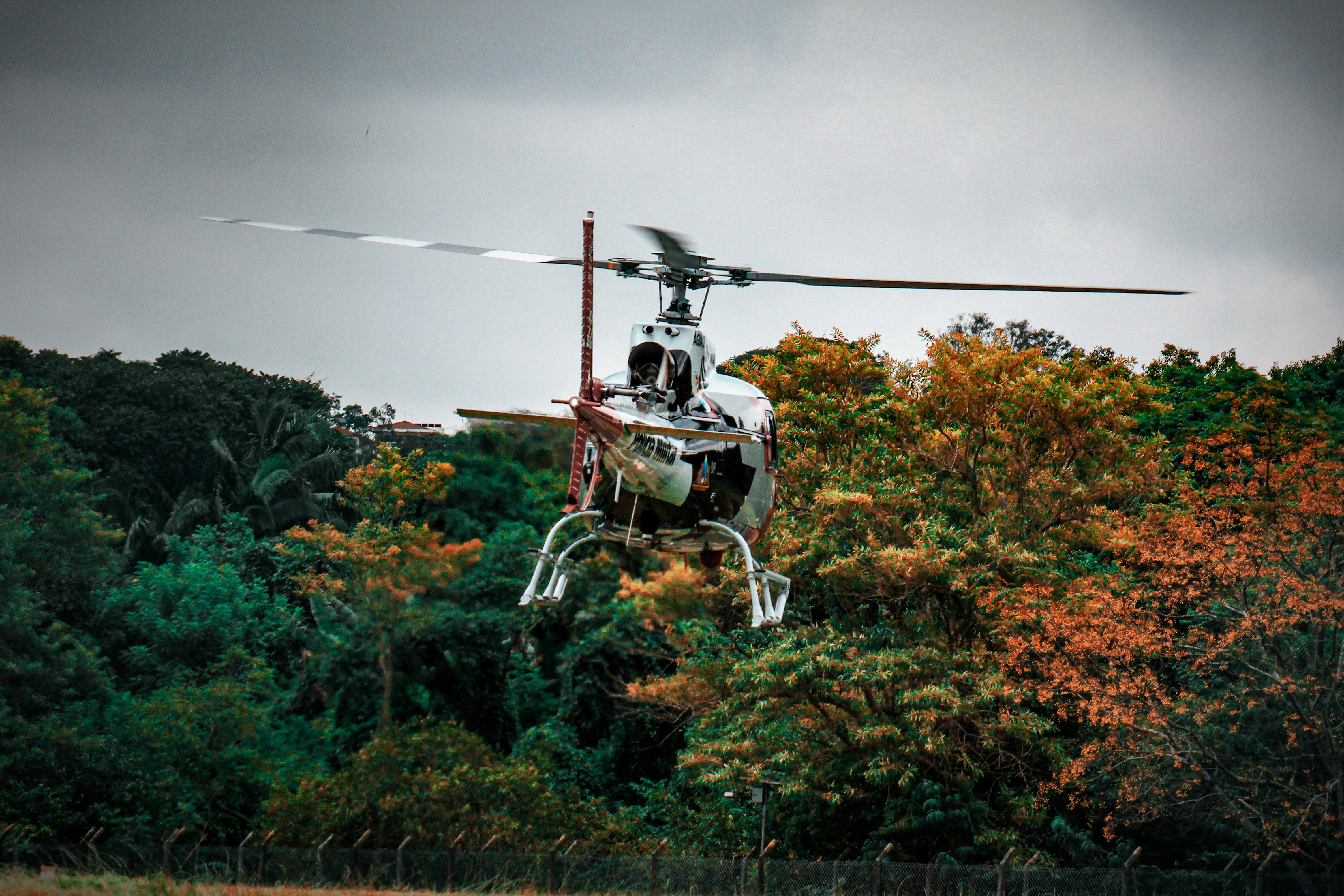 a helicopter that is flying in the air