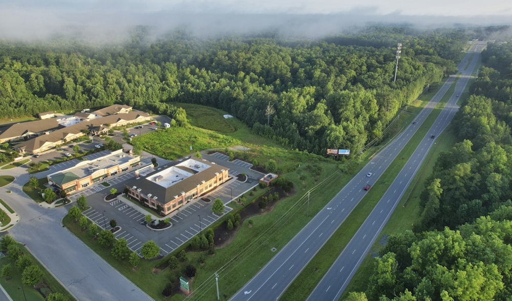 an aerial view of a large building surrounded by trees