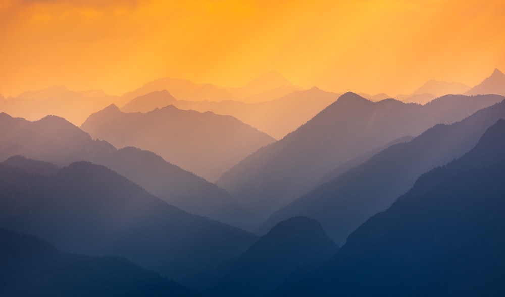 a view of a mountain range at sunset