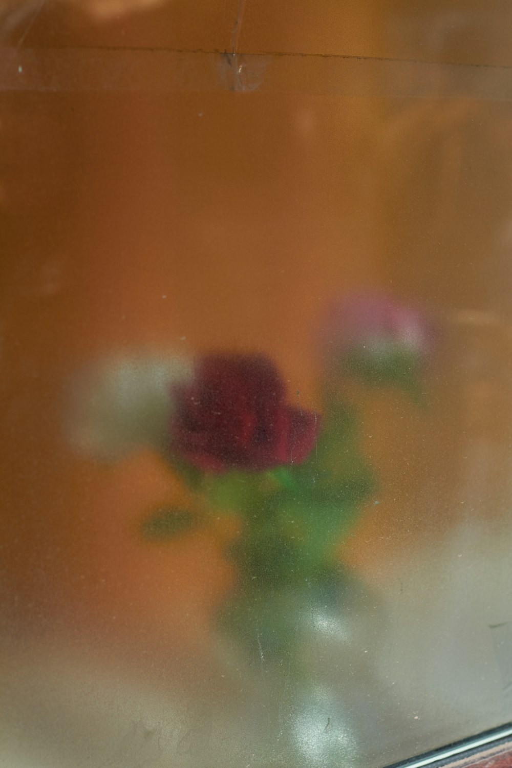 a vase of flowers sitting on a window sill