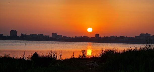 A serene sunset over an Asian coastal city skyline, symbolizing peaceful retirement.