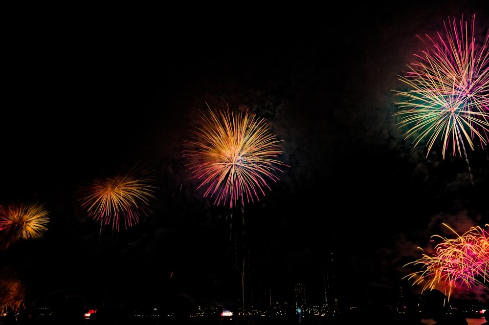 a bunch of fireworks are lit up in the night sky