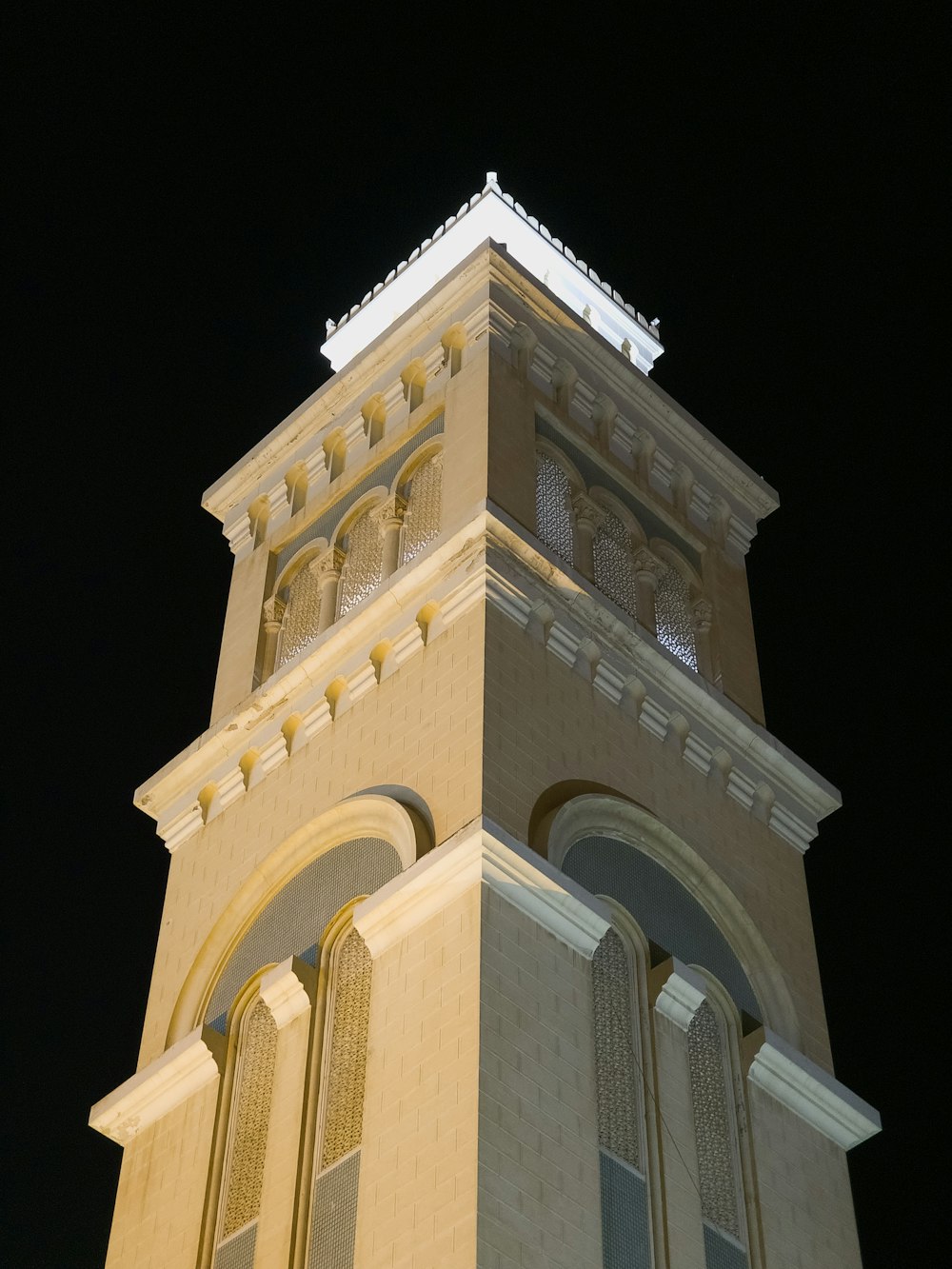 a tall tower with a clock on the top of it