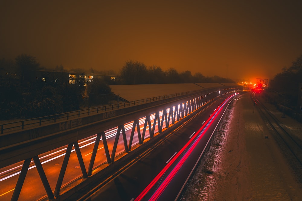 a long exposure shot of a highway at night