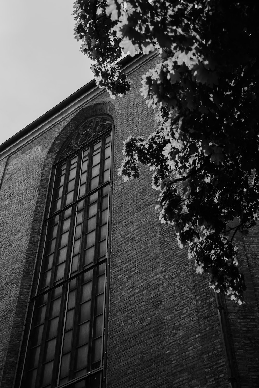 a black and white photo of a tall building