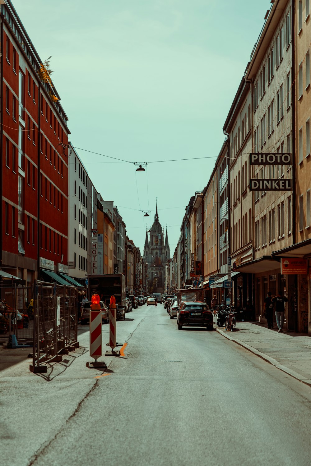 a city street with cars parked on the side of it