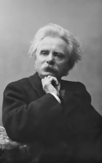 A vintage black-and-white portrait of the founder of Opus Dei, showing his thoughtful expression.