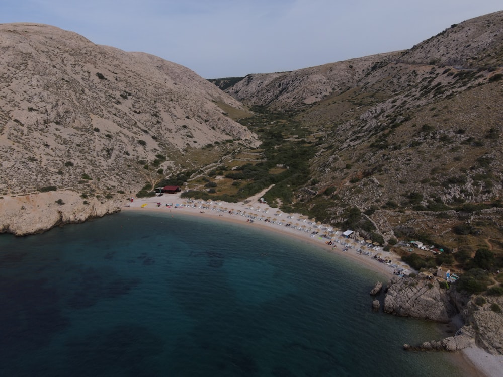 an aerial view of a beach in the mountains