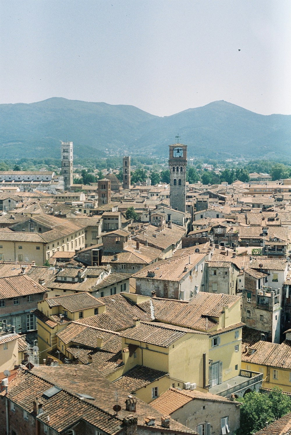 a view of a city with mountains in the background