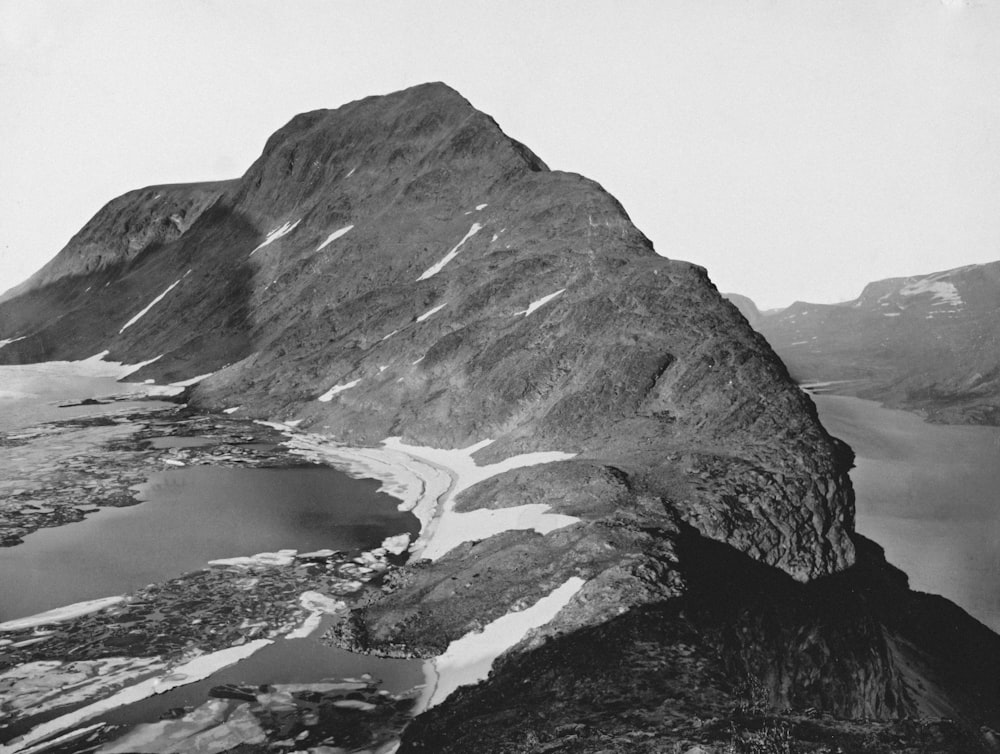 a black and white photo of a mountain