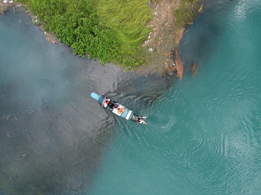 two people in a boat on a body of water