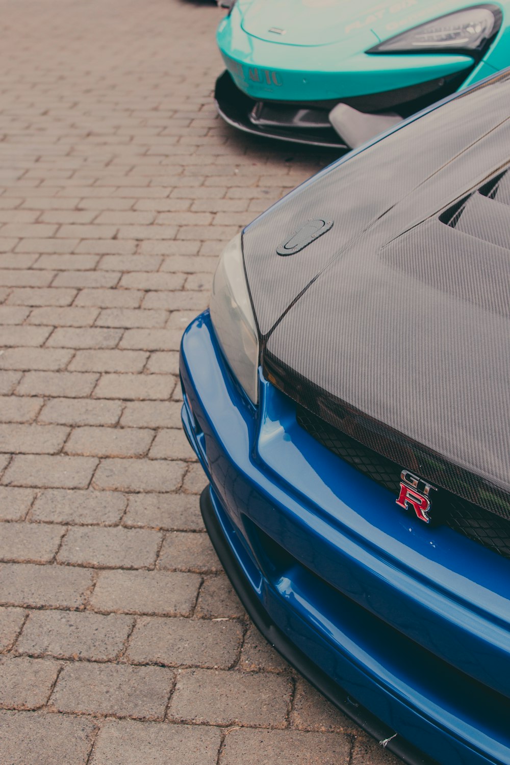 a close up of the hood of a sports car