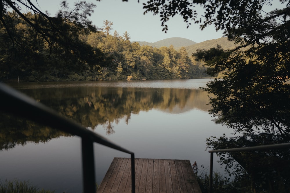 a wooden dock sitting next to a body of water