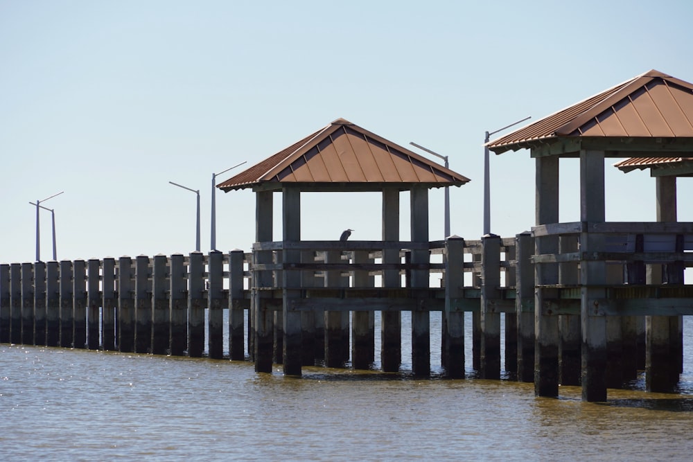 a couple of wooden piers sitting next to a body of water
