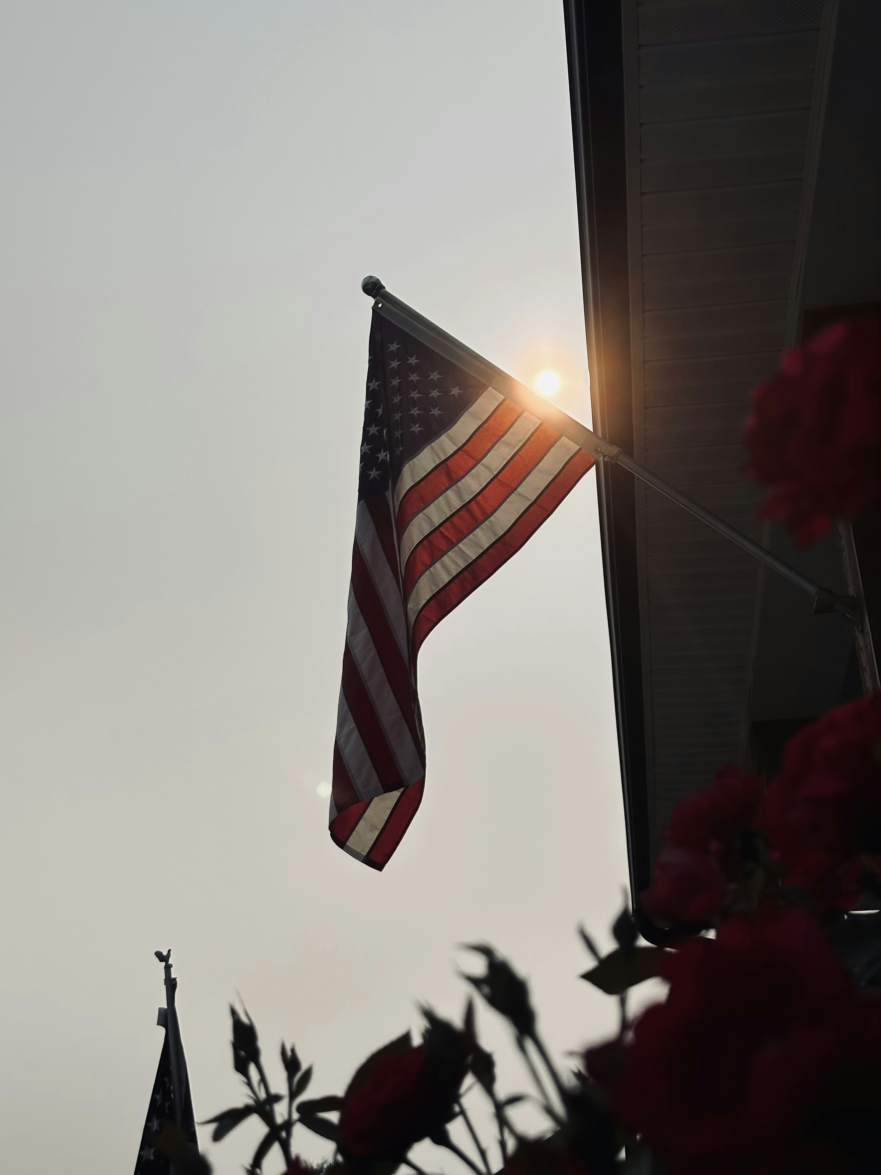 an american flag is flying in the sky